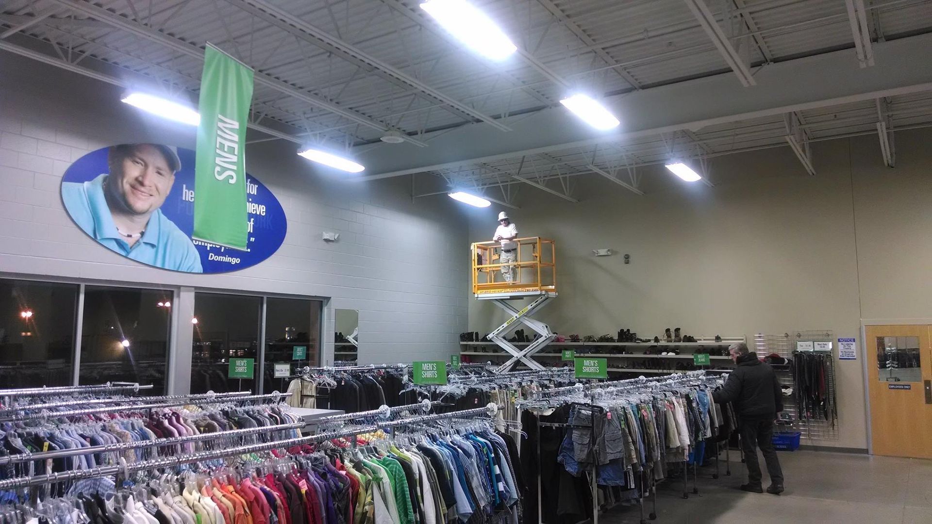 A Worker on Top of Lifter Inside Clothing Store - Chicago, IL - McMaster Painting