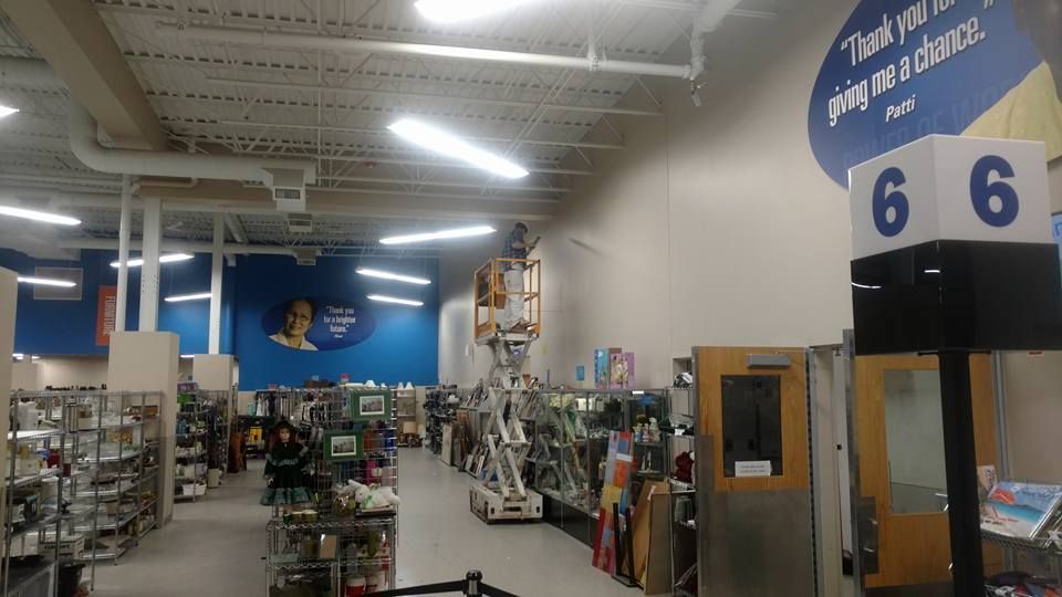 A Worker Adding Paint to Wall - Chicago, IL - McMaster Painting