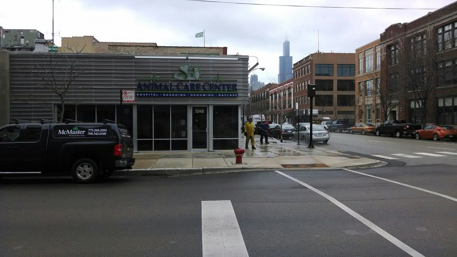A Black Truck Is Parked In Front Of A Building That Says ' Sr ' On It — Chicago, IL — McMaster Painting