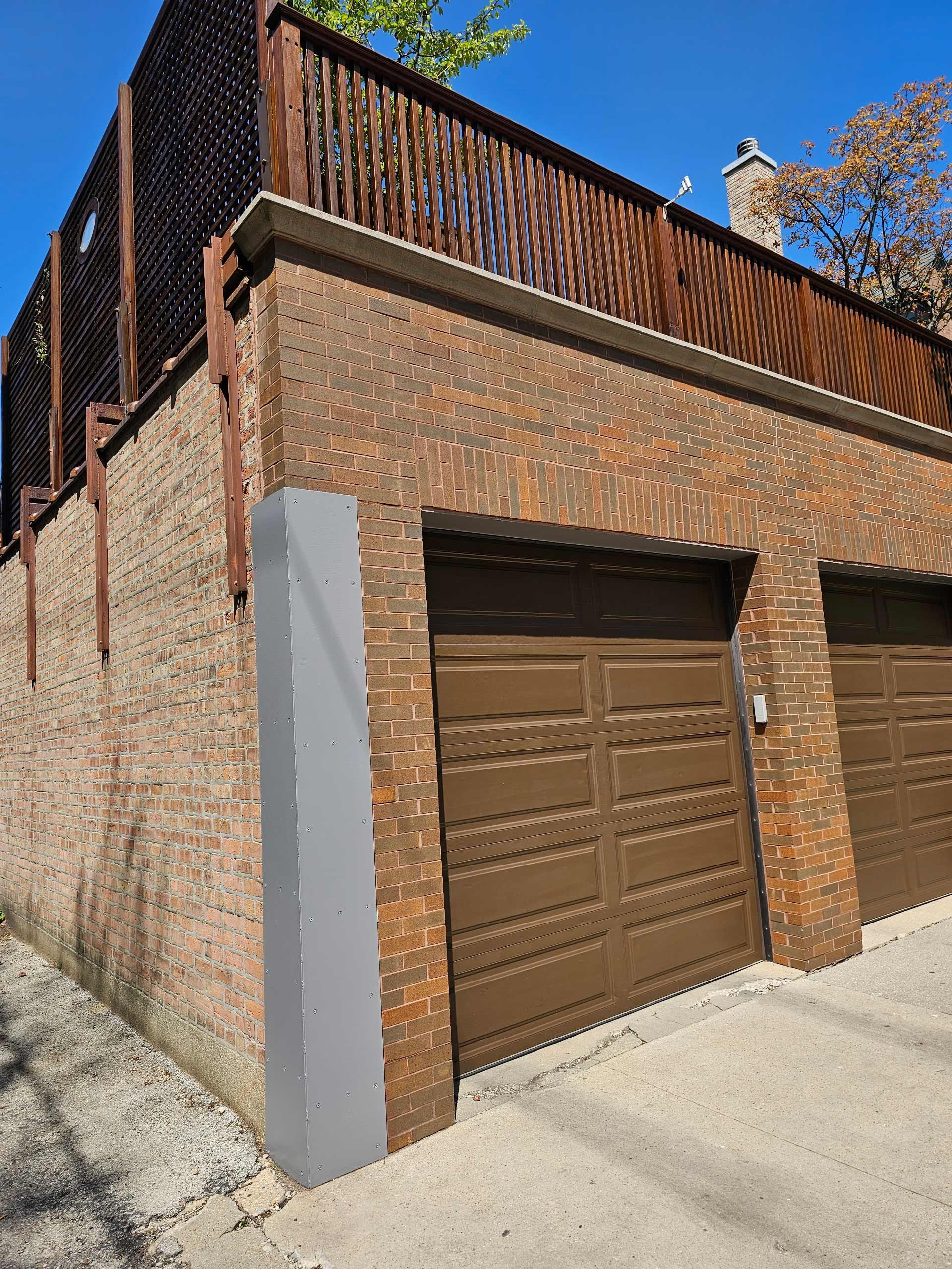 Brick Building With Two Brown Garage Doors — Chicago, IL — McMaster Painting