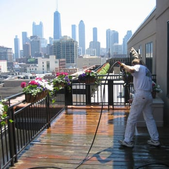 A Man Is Cleaning Deck — Chicago, IL — McMaster Painting