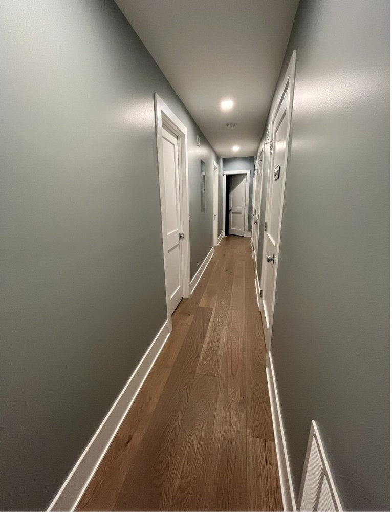 A Long Hallway With Hardwood Floors — Chicago, IL — McMaster Painting