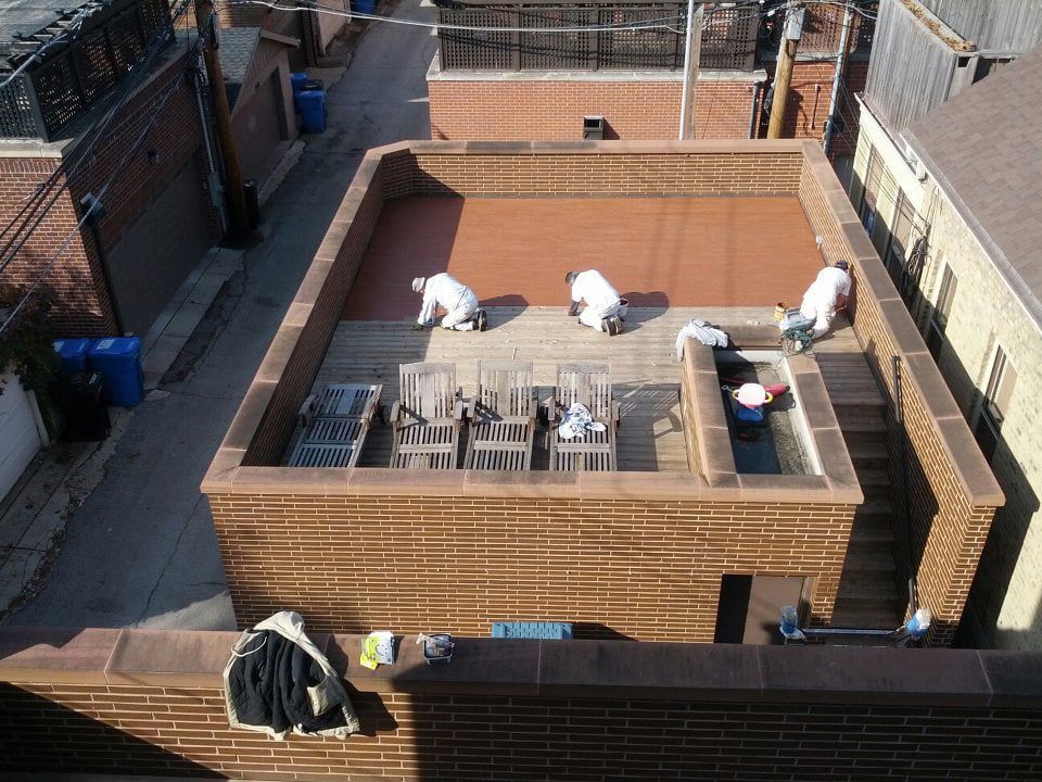 Working on the Roof of a Building — Chicago, IL — McMaster Painting