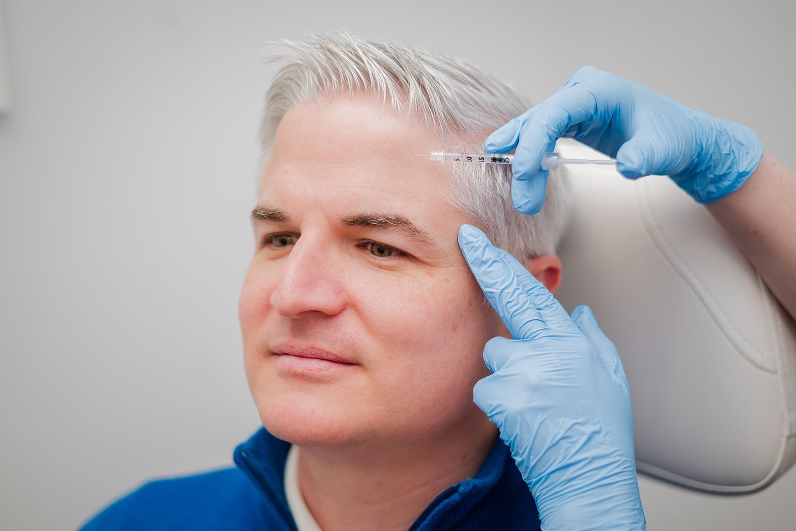 Male patient receiving botox treatment