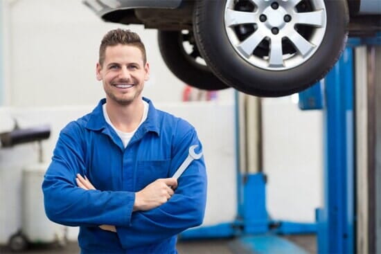 Car mechanic smiling— in Duluth, MN
