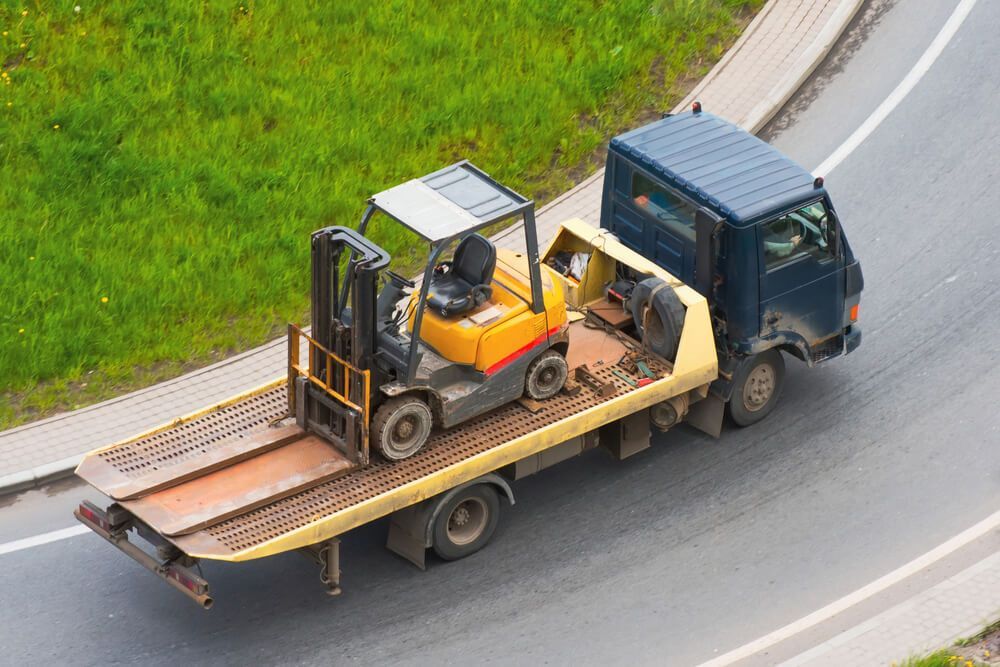 Forklift On The Back Of A Tow Truck — Big Tim's Towing in Maitland, NSW
