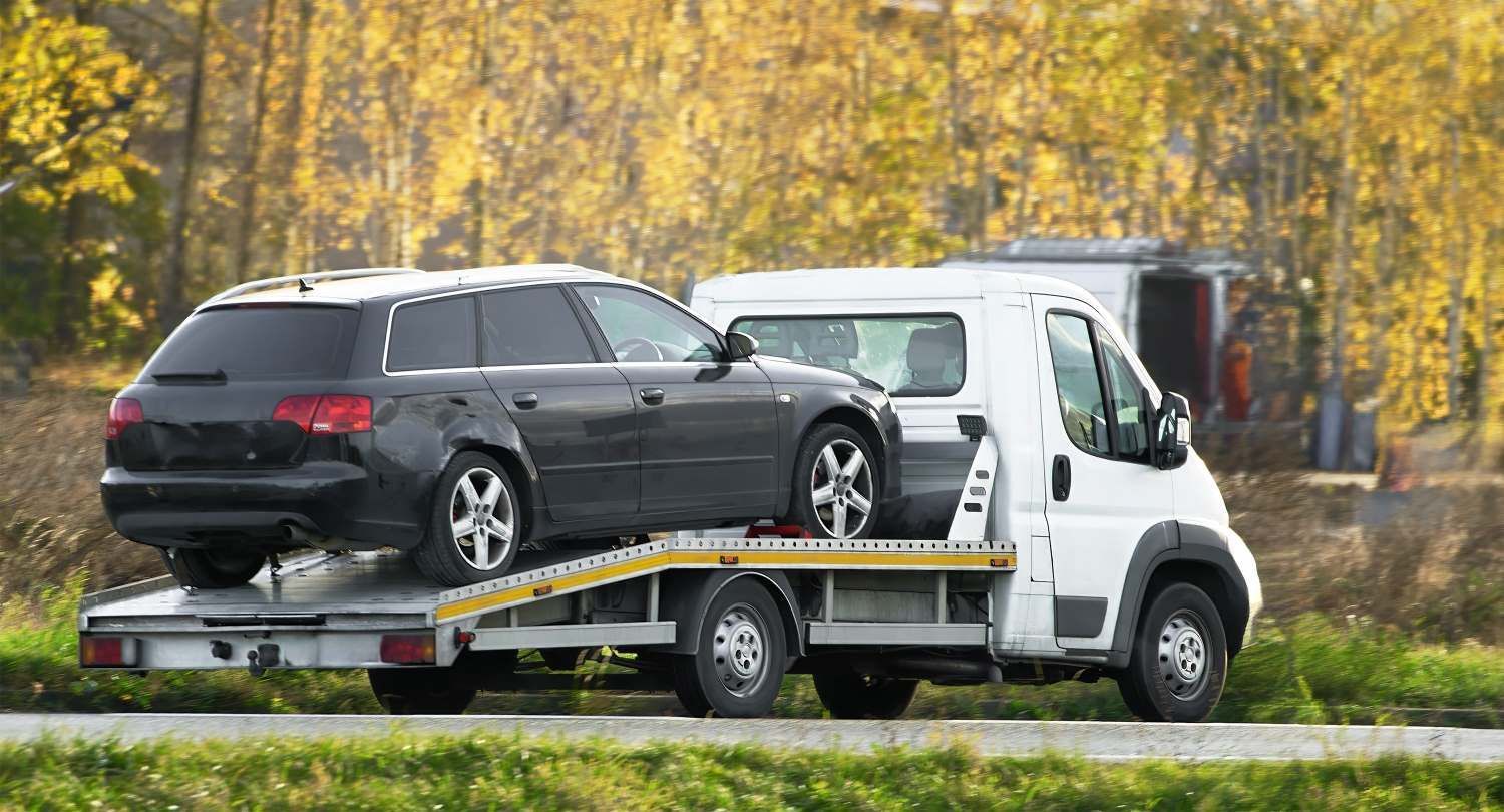 A Tow Truck Recovery With A Flatbed Can Transport — Big Tim's Towing in Kotara, NSW