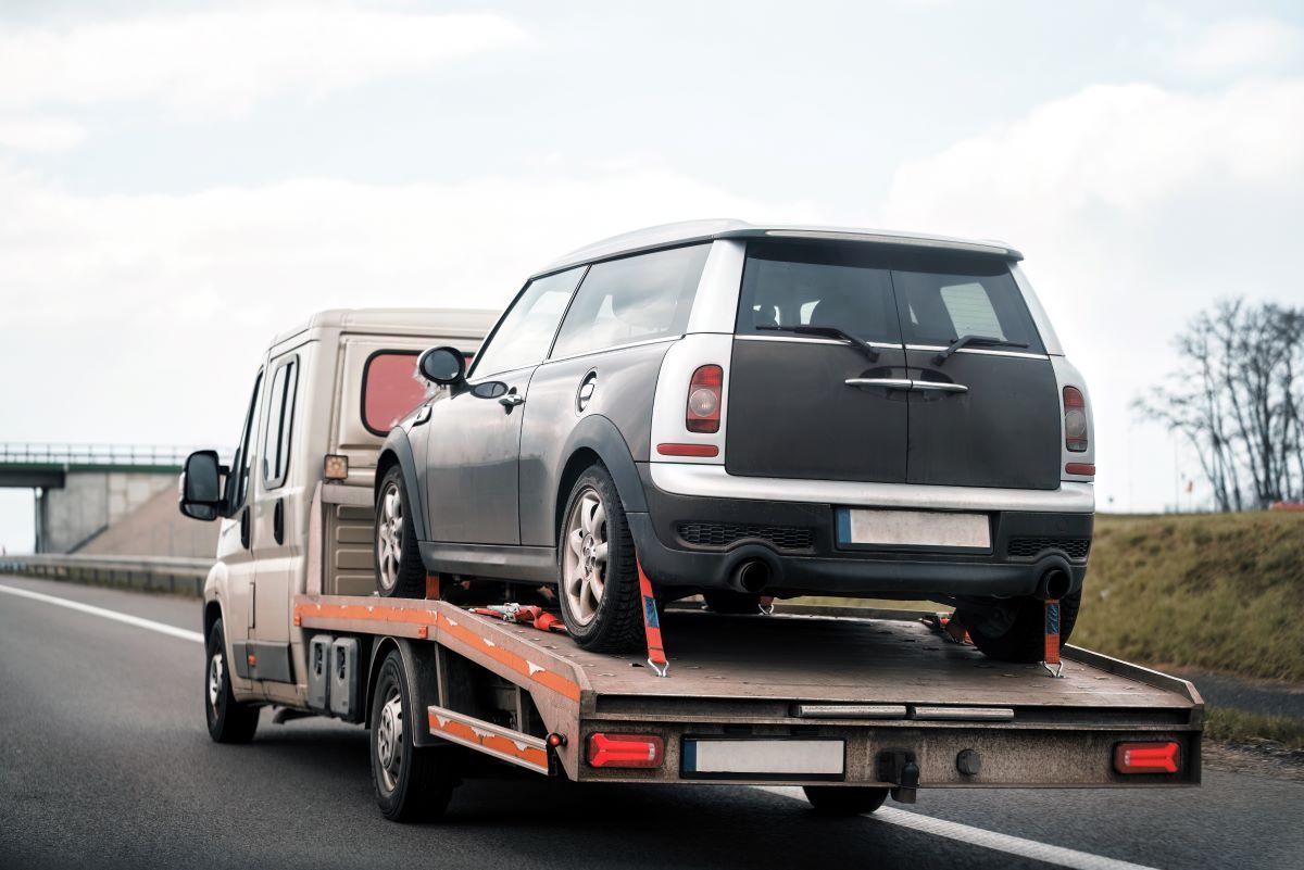 Small Black Car Towing — Big Tim's Towing in Raymond Terrace, NSW