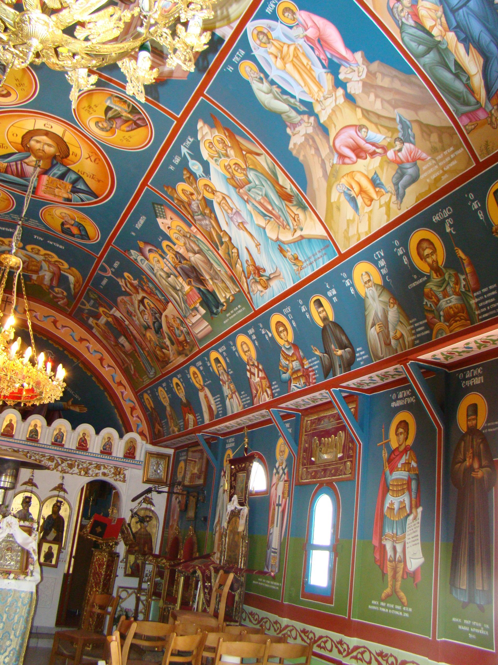 A church with a lot of paintings on the walls and ceiling
