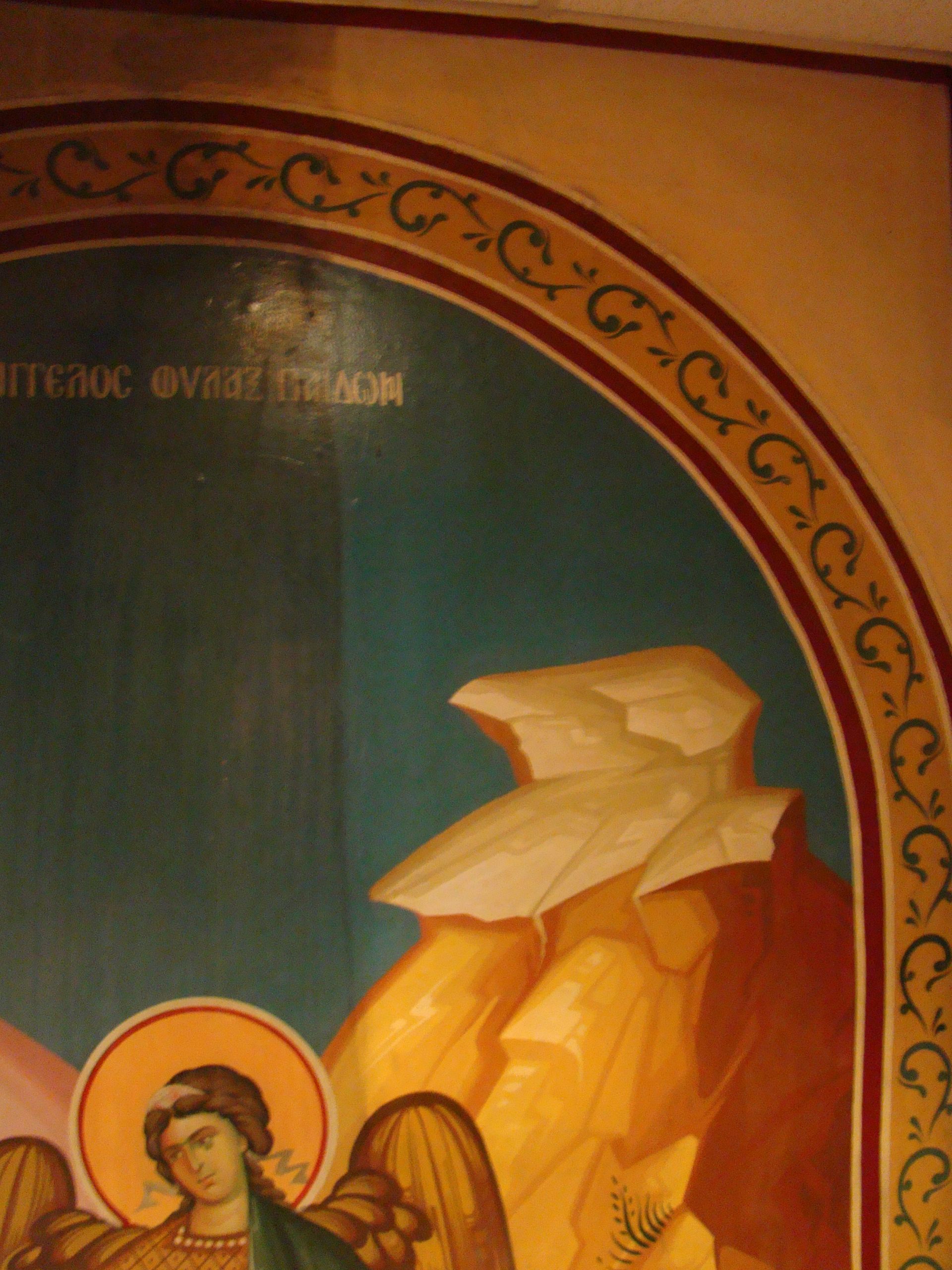 A close up of a painting of a woman with angels