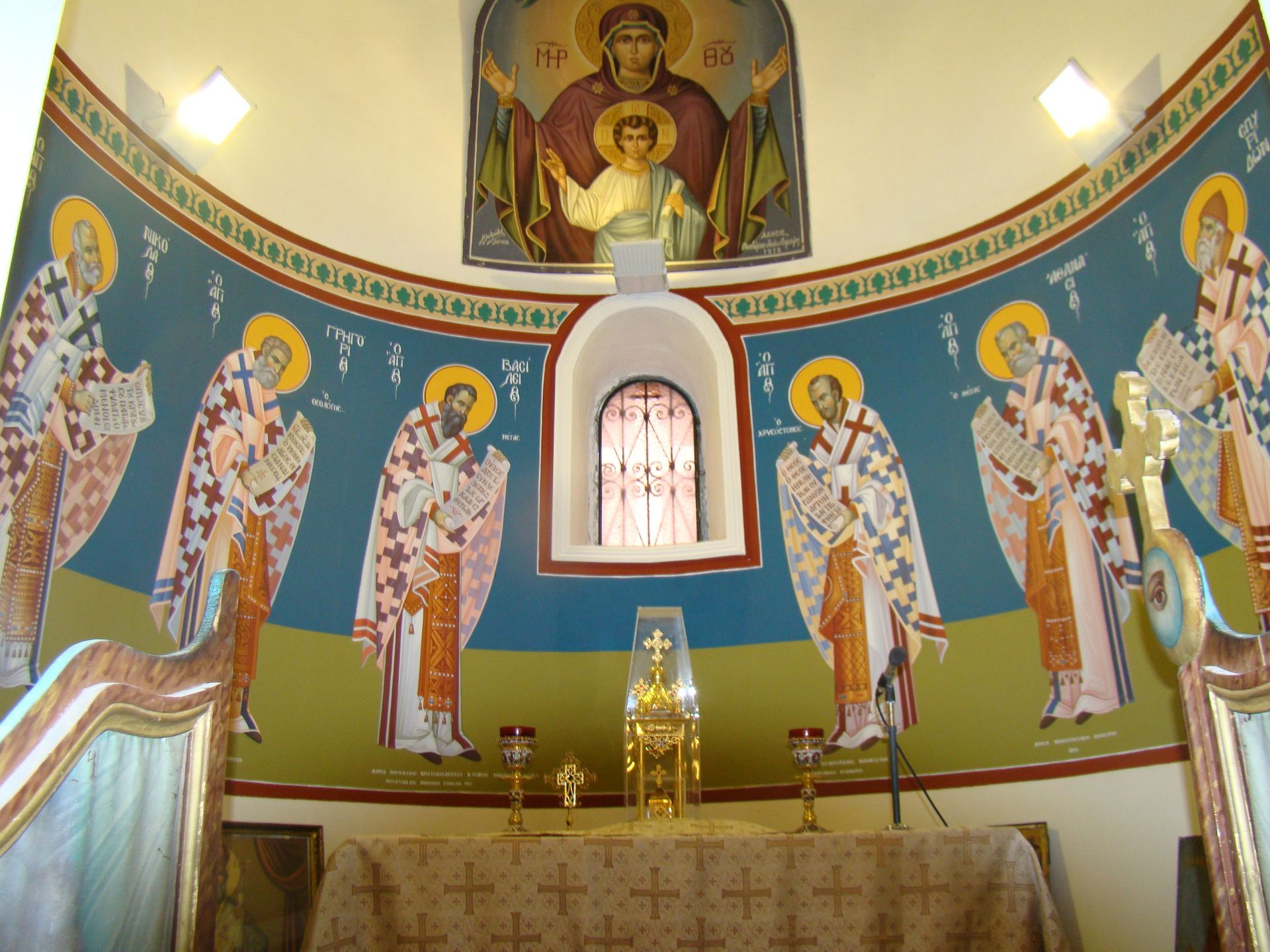 A church with a painting of jesus and angels on the wall
