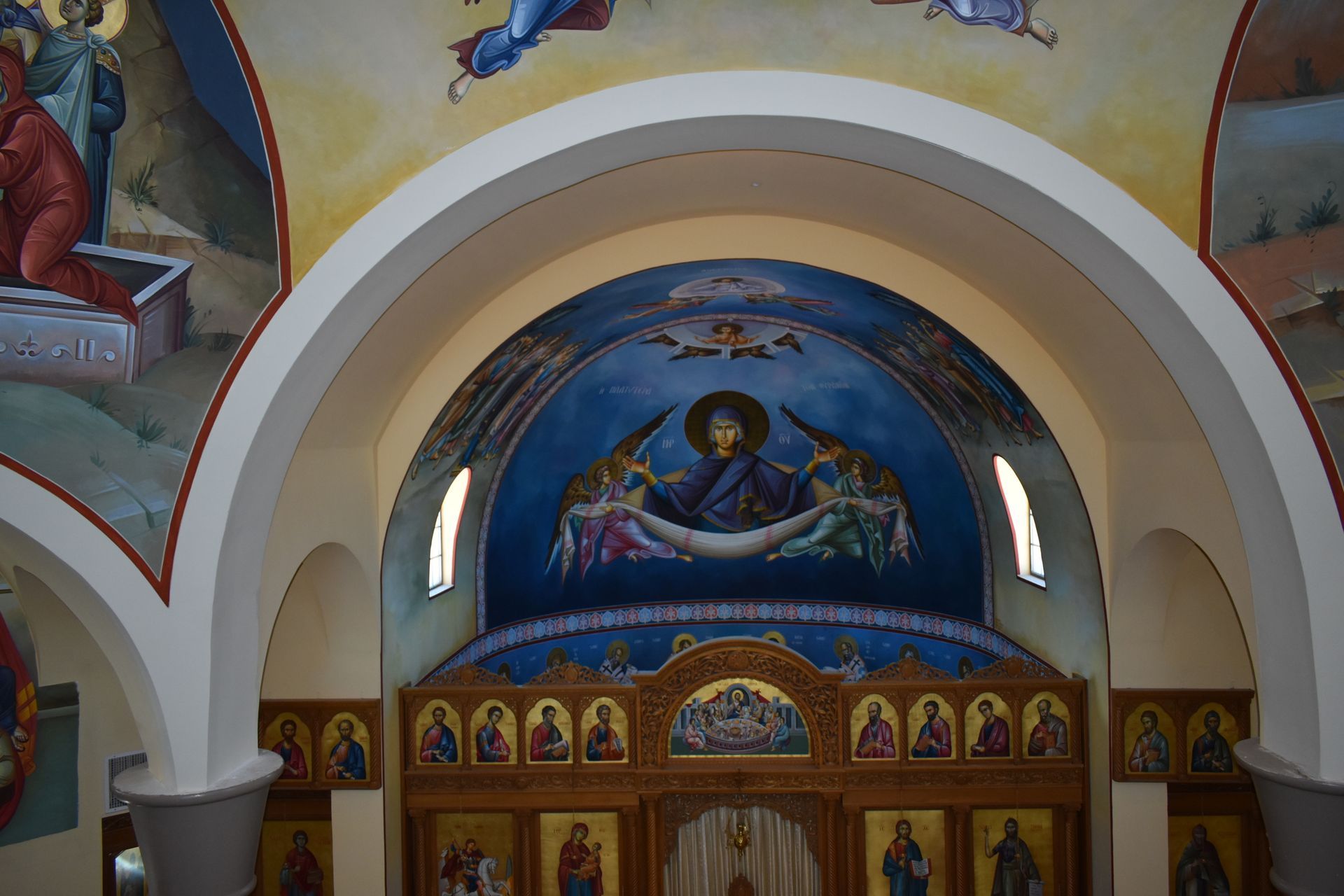 A church with a painting of jesus on the ceiling