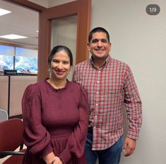 A man and a woman are posing for a picture together