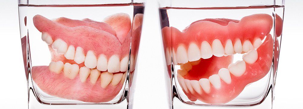 dentures in glasses of water