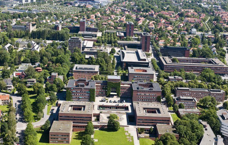 An aerial view of a city with lots of buildings and trees