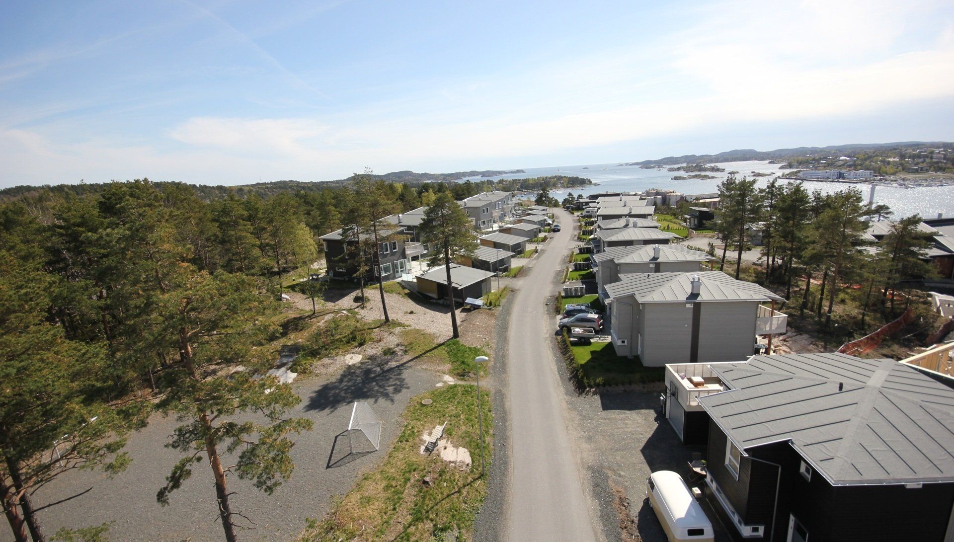 An aerial view of a residential area with houses and trees