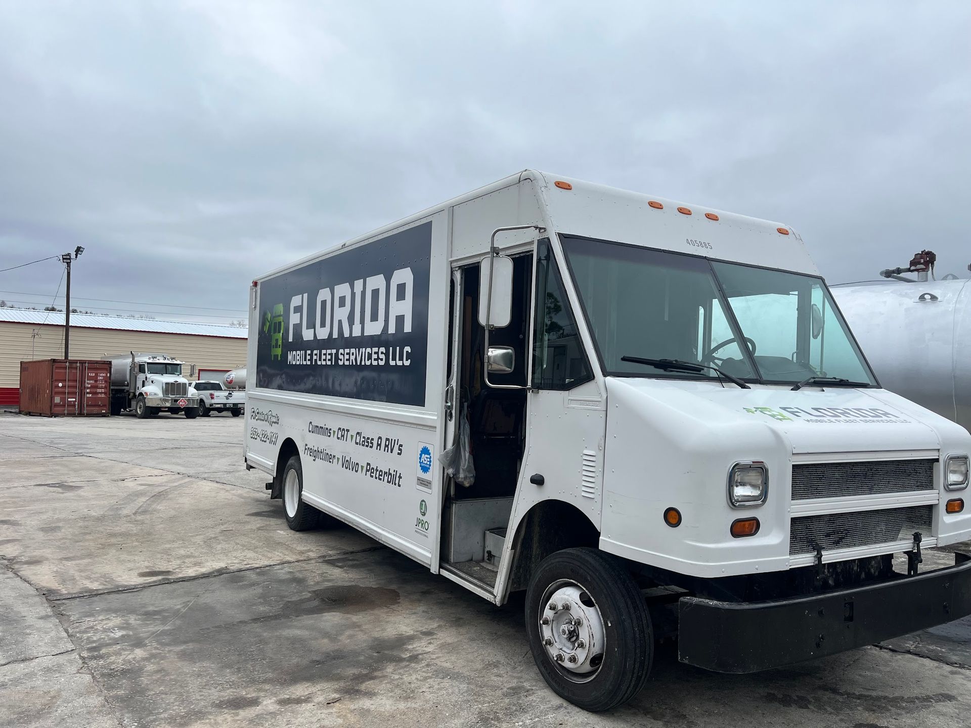 A white van with the word florida on the side is parked in a parking lot.