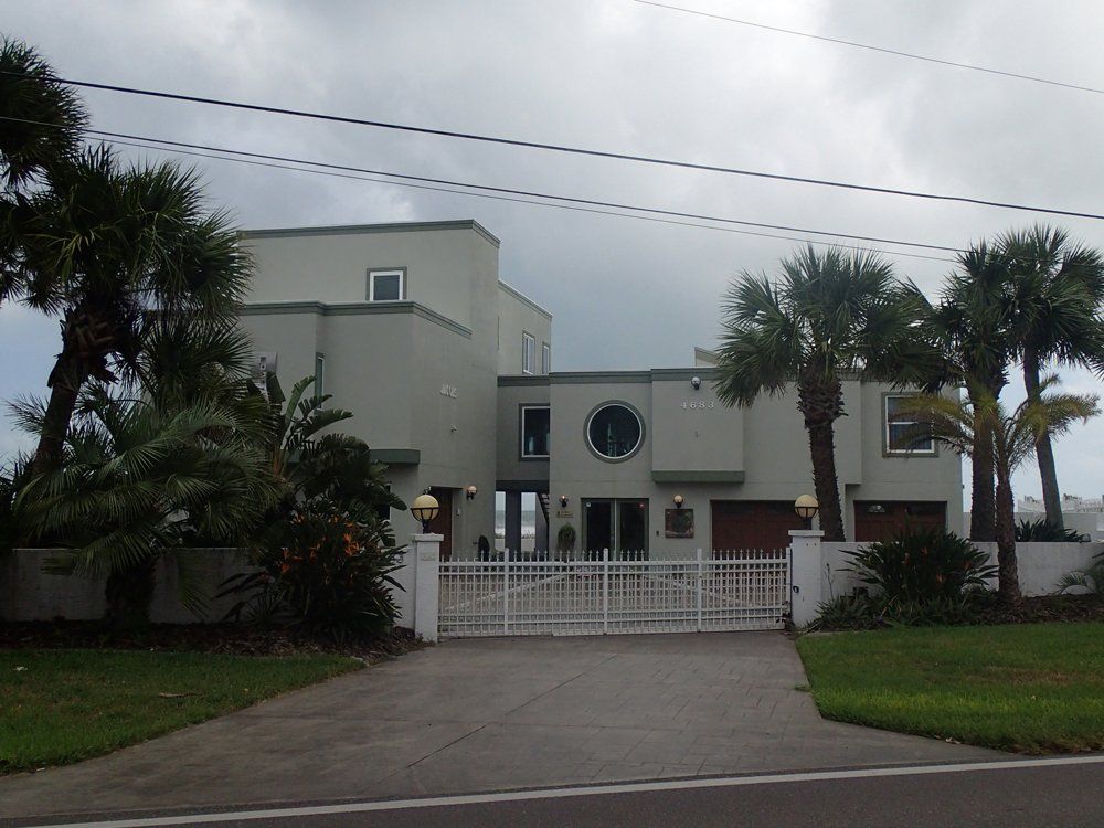 White Gate on Modern House — South Daytona Beach, FL — Dal Mar Roofing Industries Inc