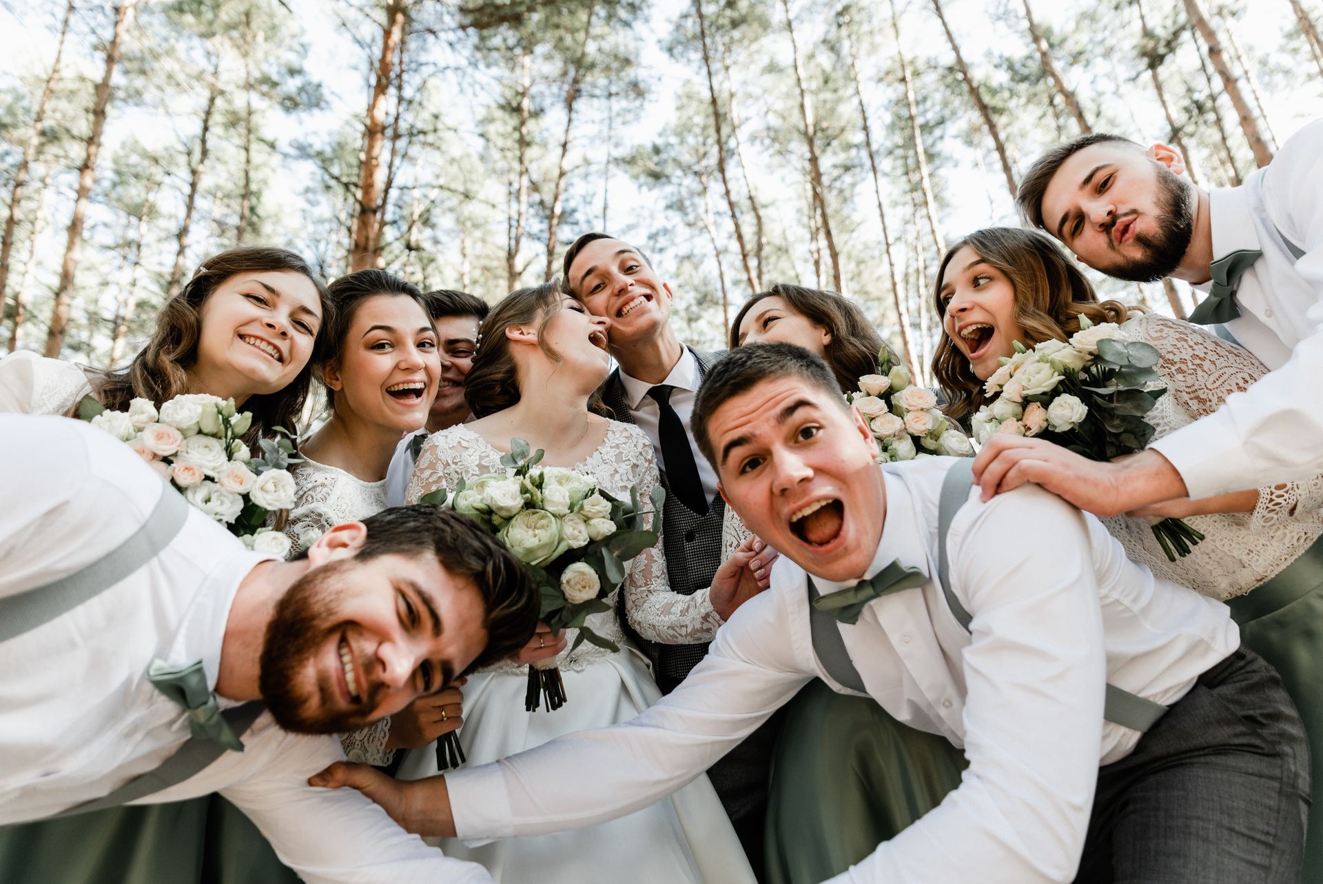 A bride and groom are posing for a picture with their bridesmaids and groomsmen at Riverside Castle in Pretoria.