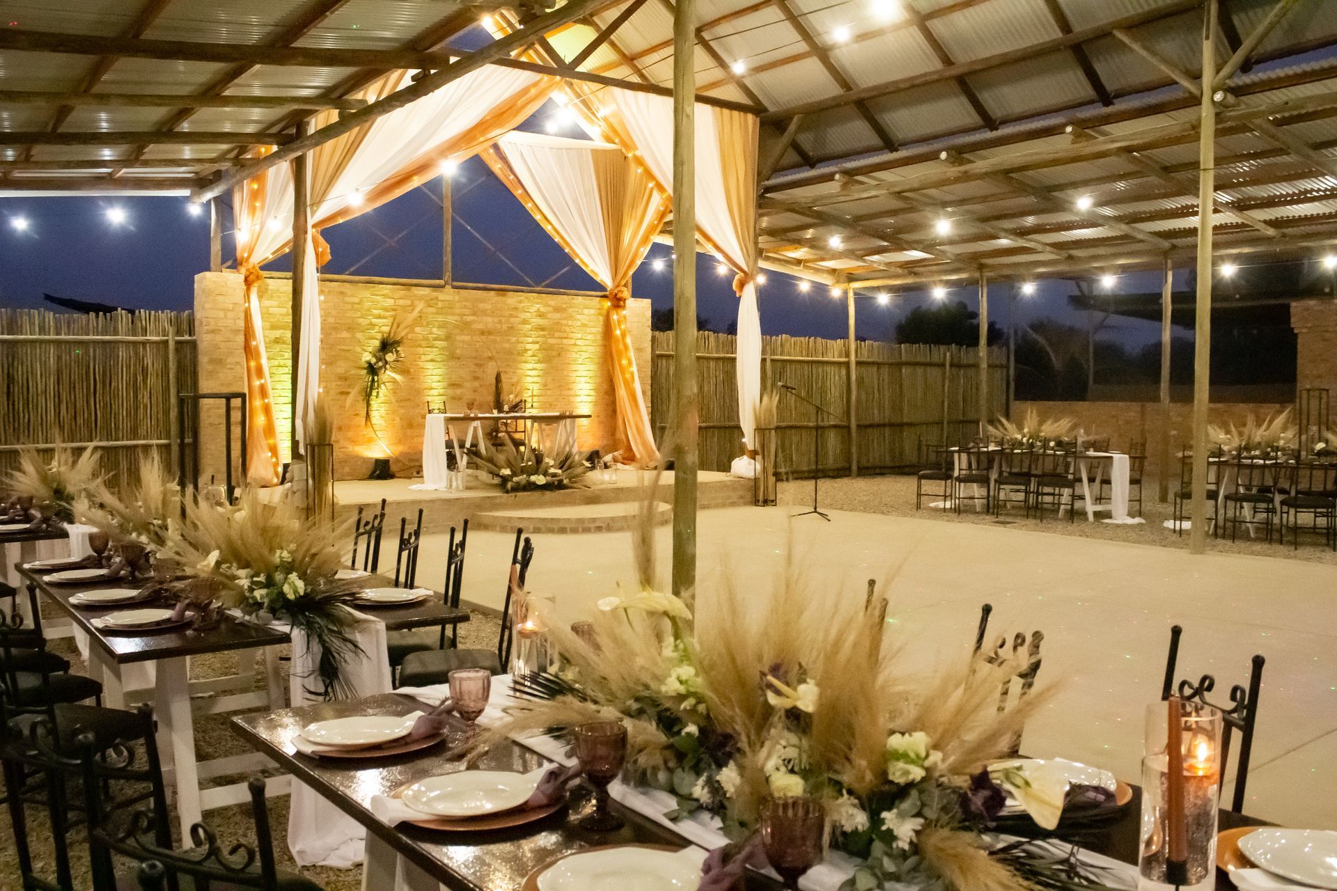 Long tables prepared for a lavish event in the Piazza at Riverside Castle, Pretoria East's major event venue.
