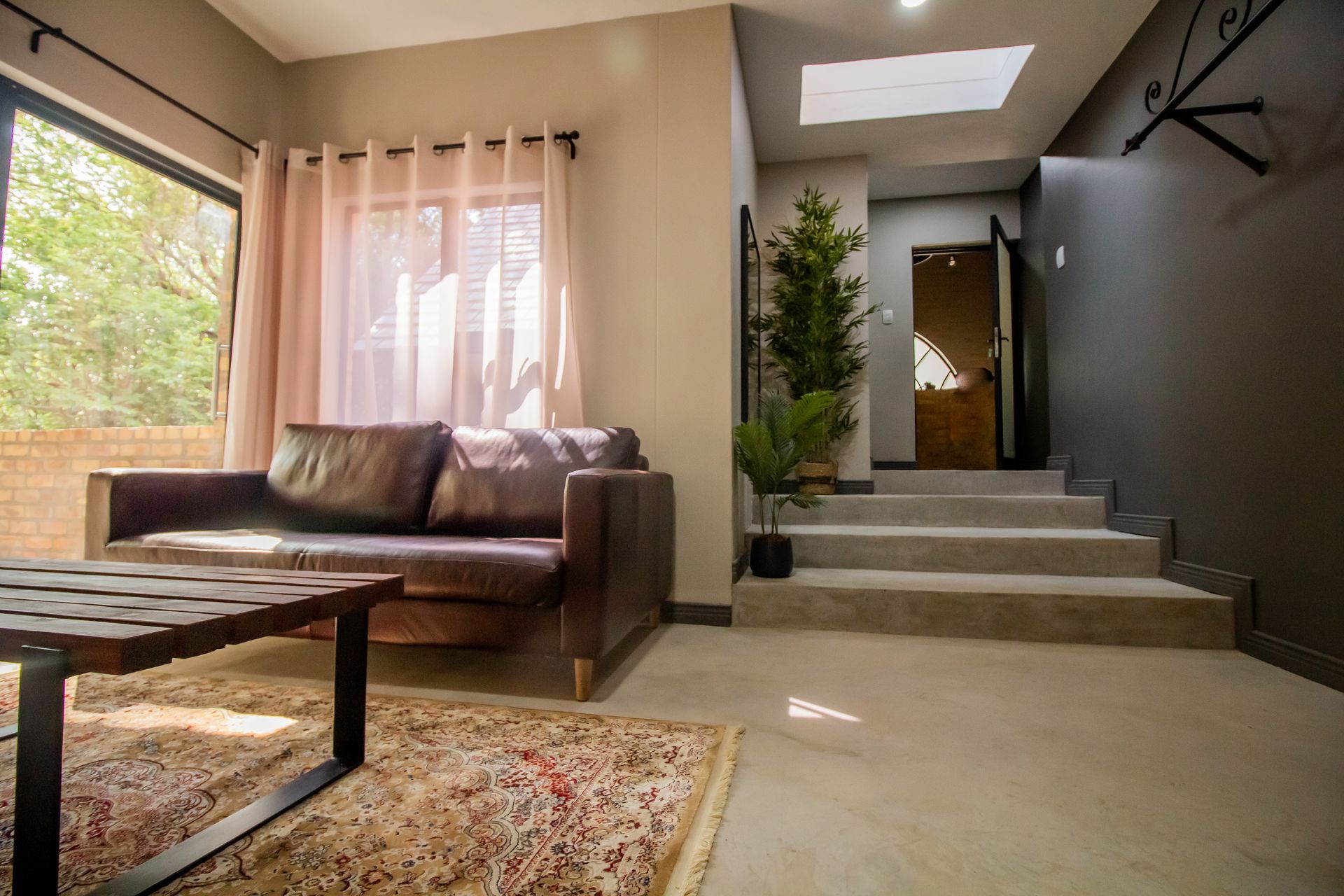 The comfortable living room in the Honeymoon Suite at the Riverside Castle wedding venue.