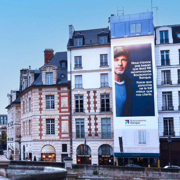 A large billboard with a picture of a man on it
