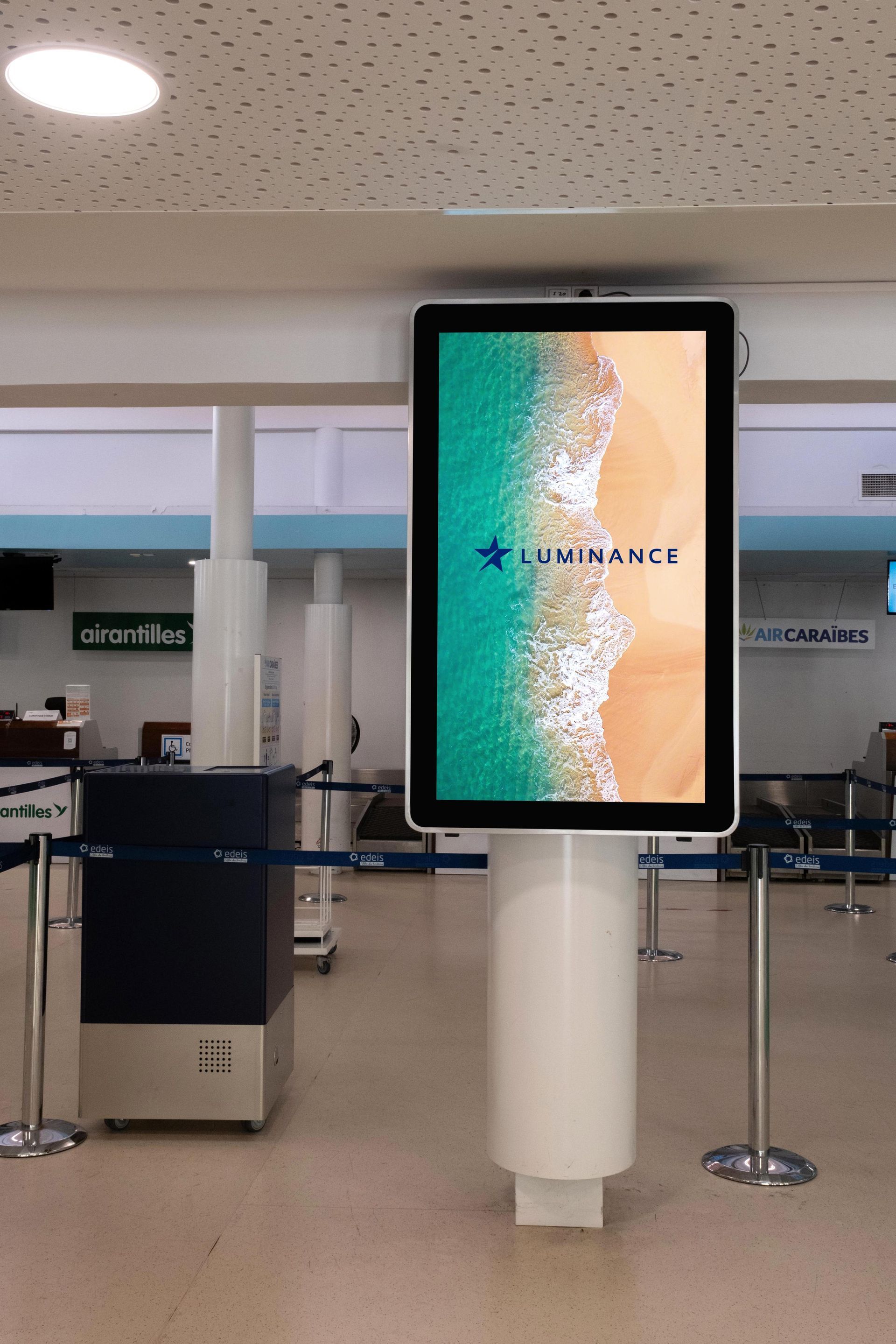 A large screen on a pole that says lumiere on it