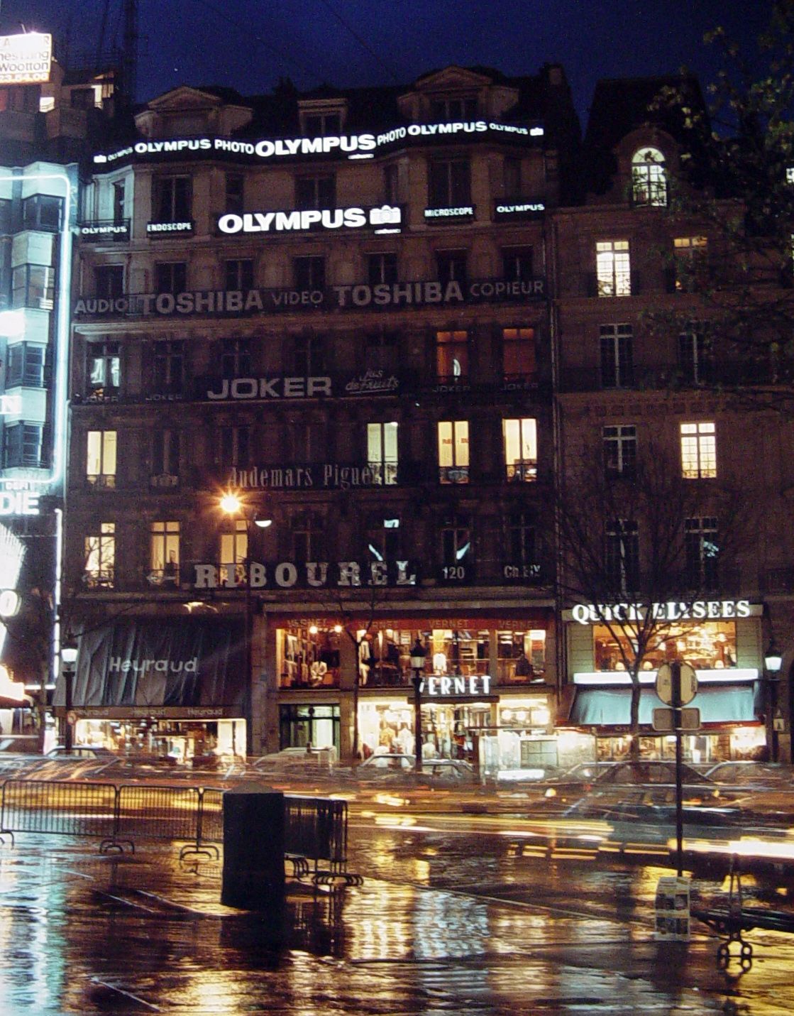 A building with the word olympus on the top of it