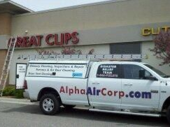 White truck with ladder beside a Great Clips shop. 