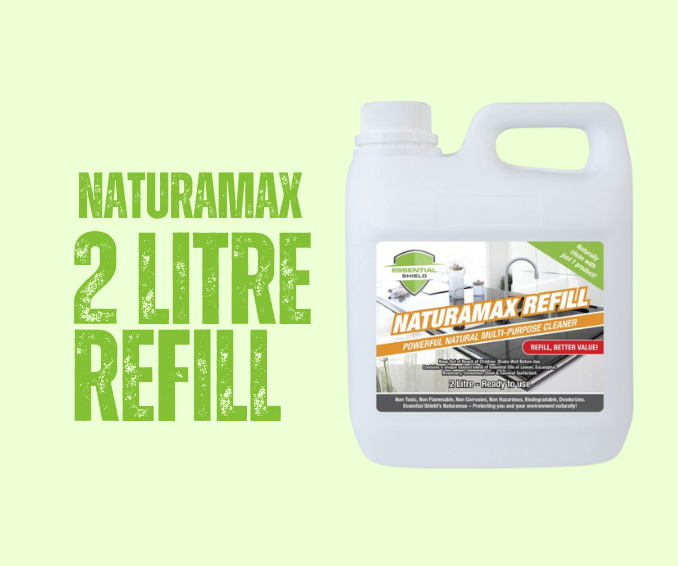 White Naturamax 2 Litre Refill container with green and orange labels, on light green background.