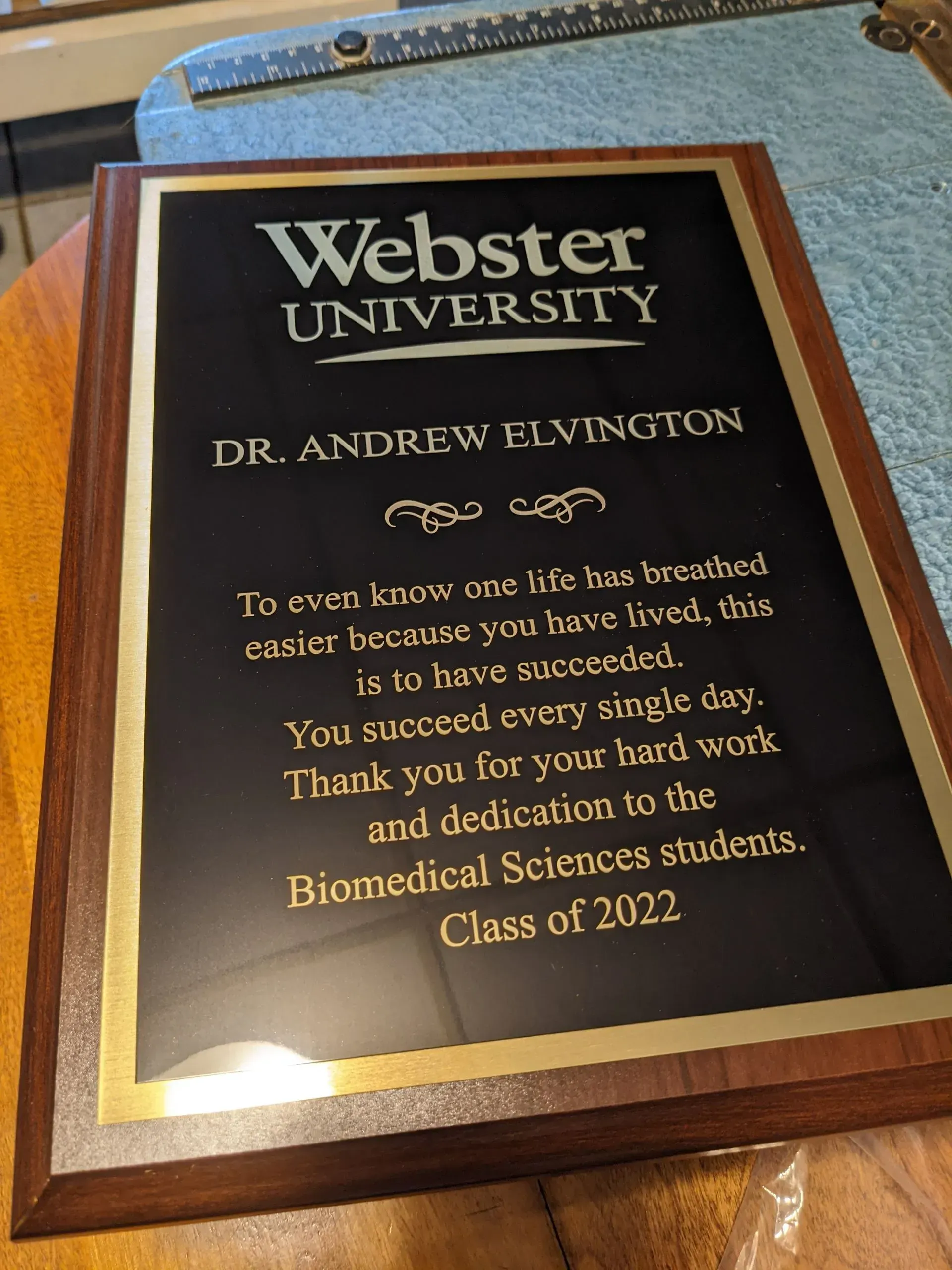 A plaque that says webster university on it