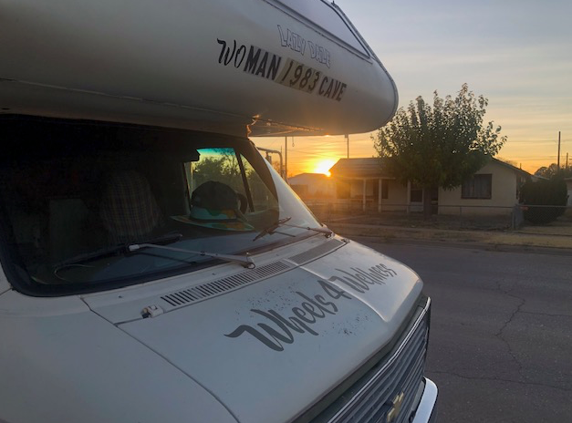 A white van with the word wheels on it