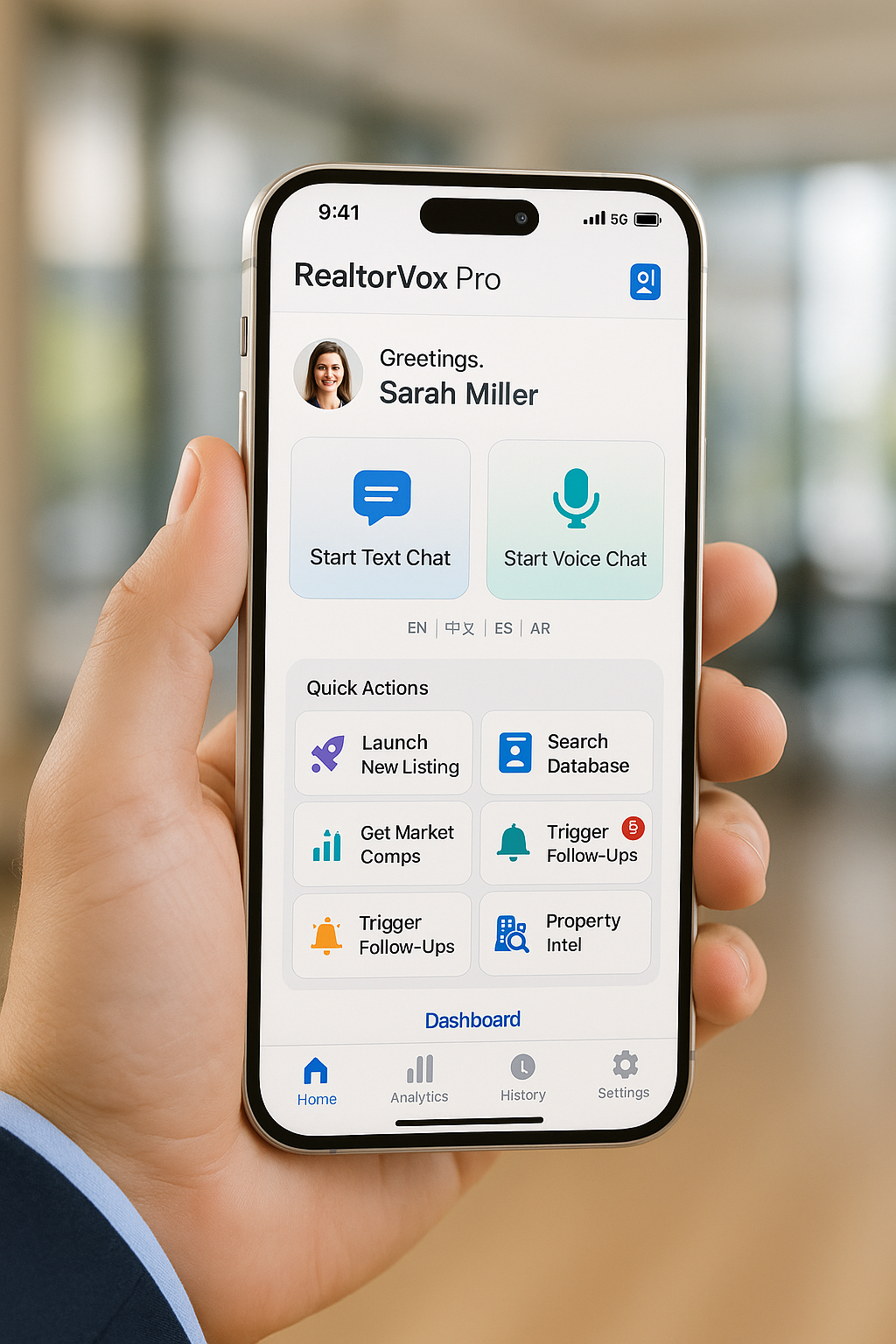 A person holds a smartphone displaying the Realtor.com app.