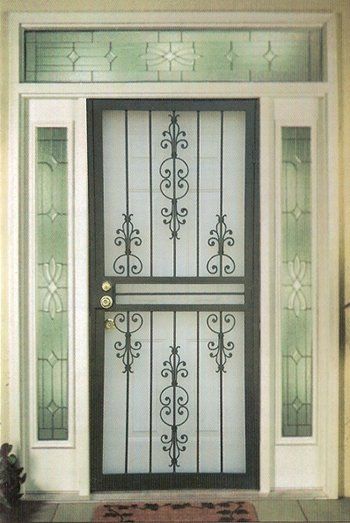 Black wrought iron security door with glass panels and decorative scrollwork.