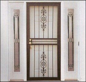 Metal security door with decorative scrollwork, flanked by white sidelights.