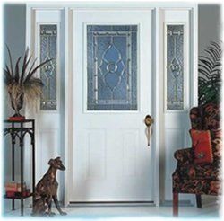 White front door with glass panel, sidelights, dog, and decorative elements.