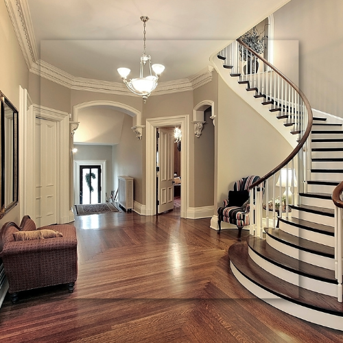 A large hallway with a curved staircase in the middle
