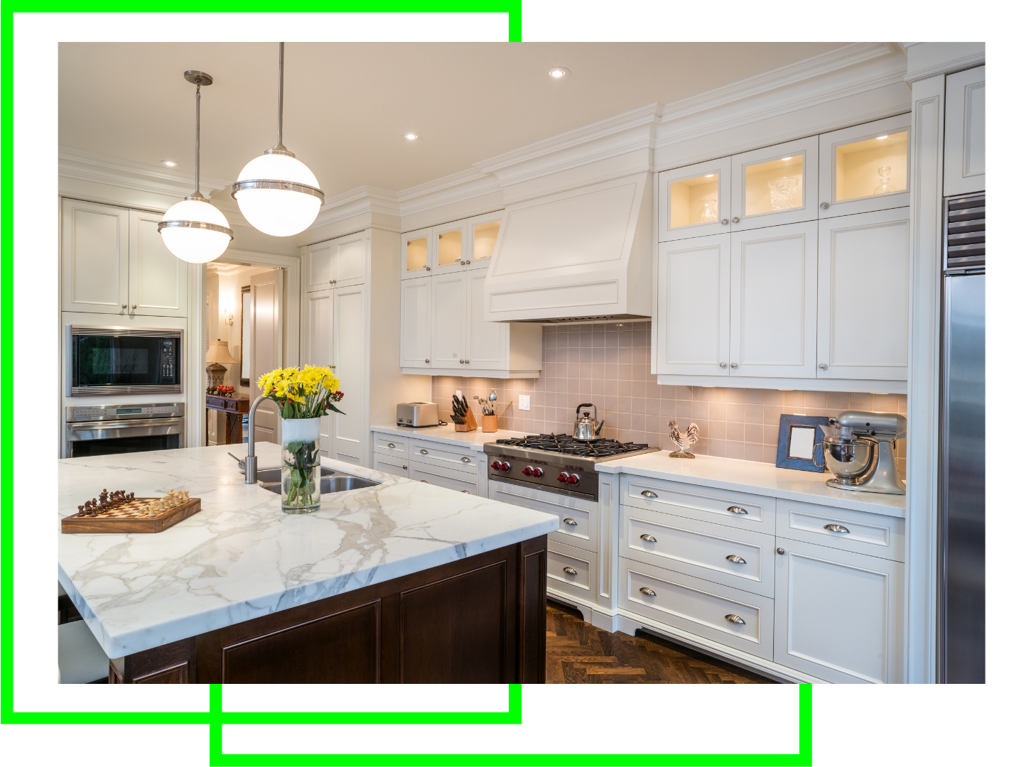 A kitchen with white cabinets , marble counter tops , and stainless steel appliances.