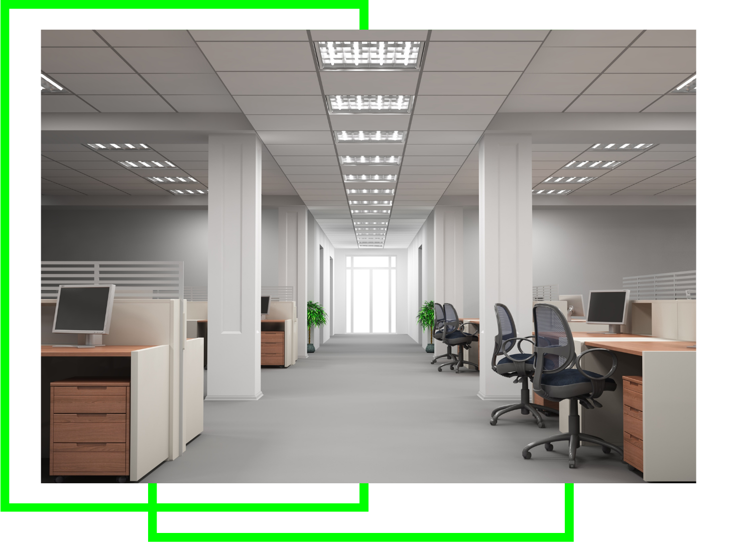 An empty office with cubicles , desks , chairs and computers.