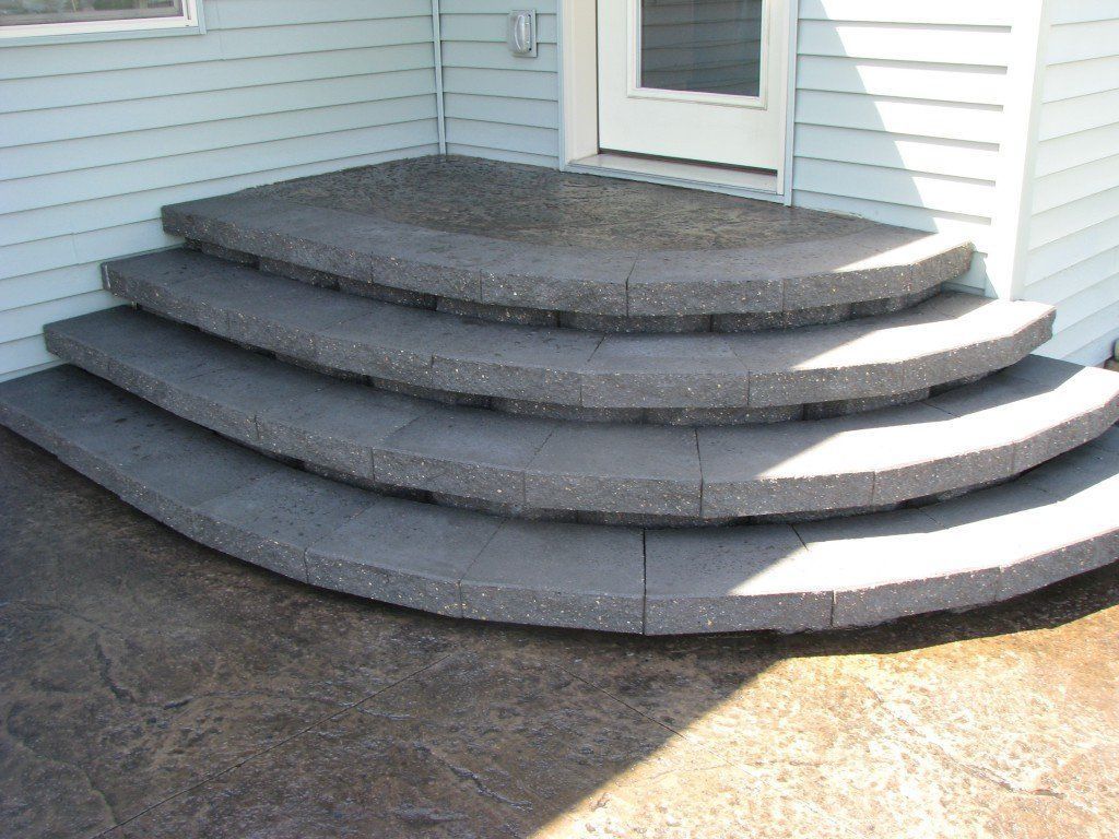 A set of curved steps leading up to a house