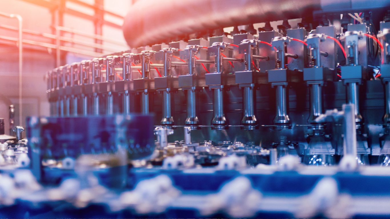 A machine is making bottles in a factory.