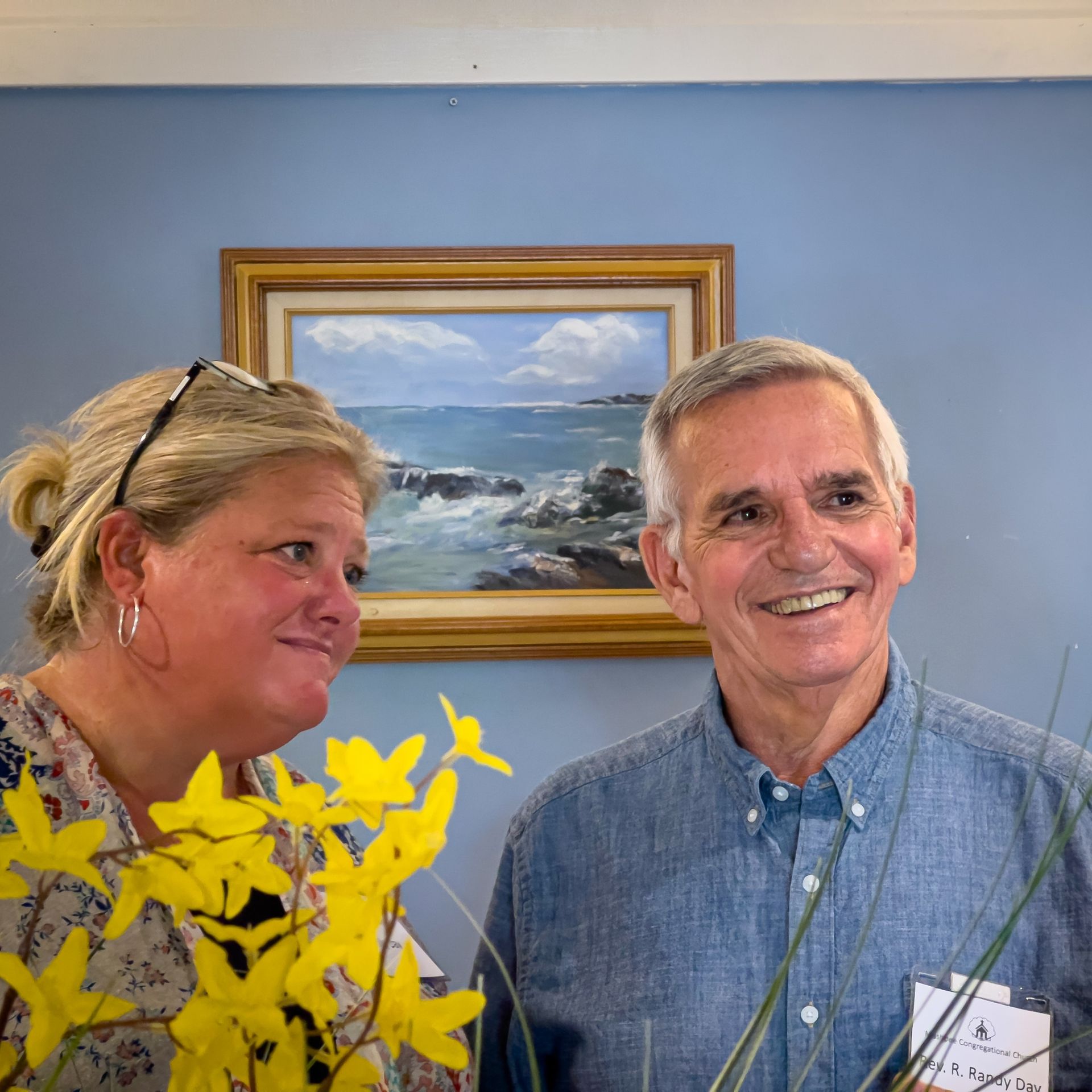 Three people are sitting at a table 