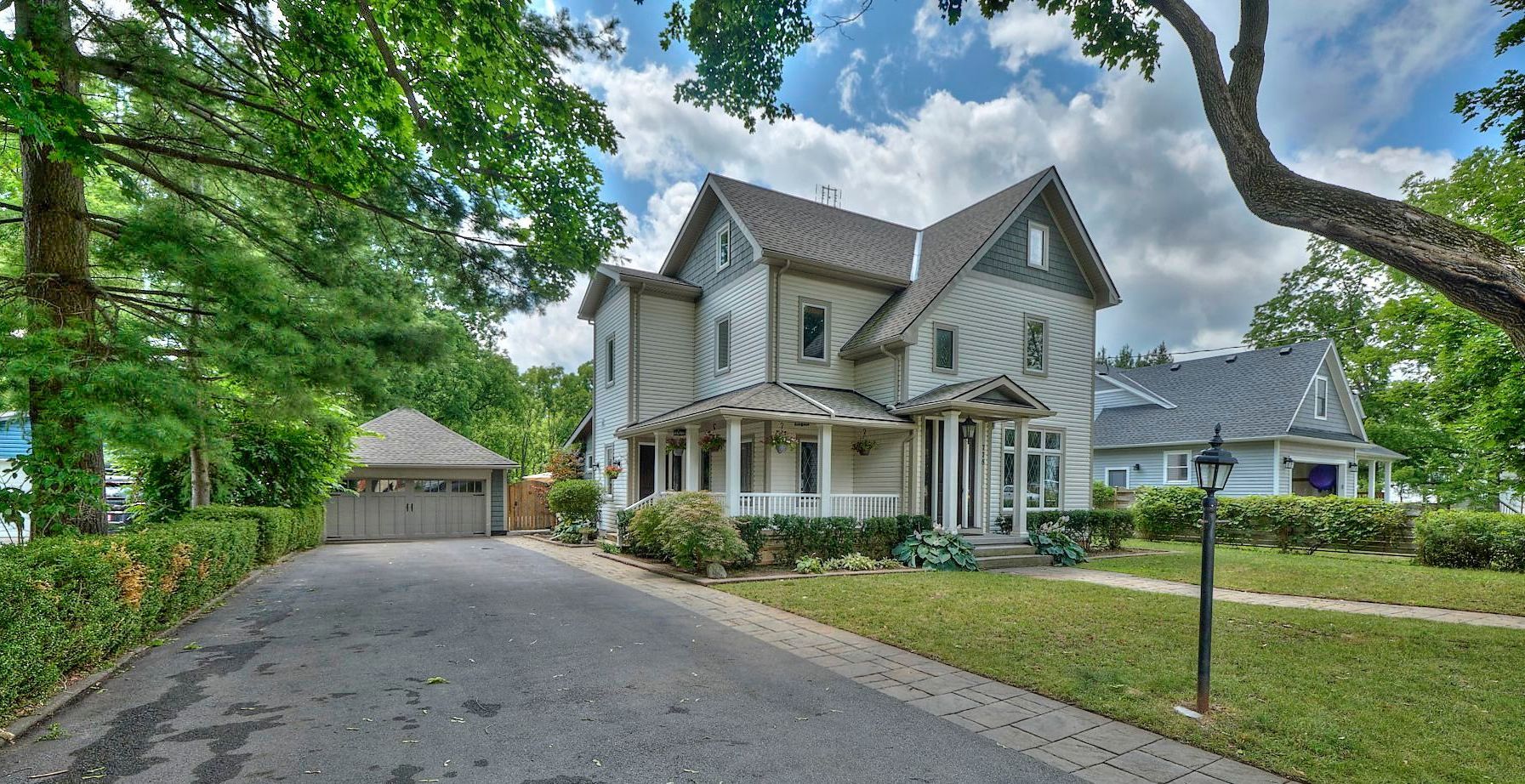 An image of a dream home set against a backdrop of lush greenery.