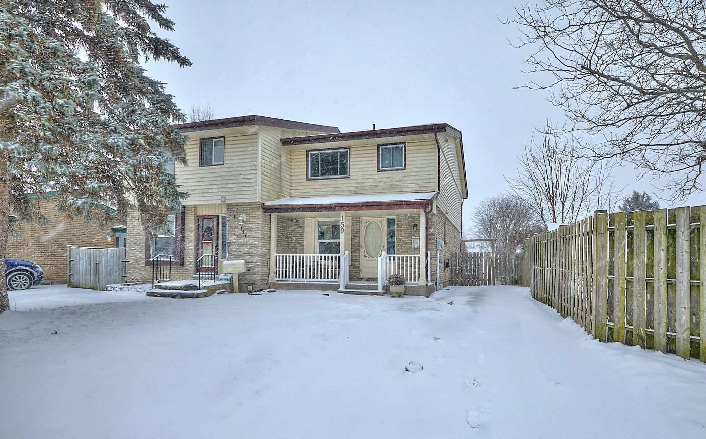 A semi-detached home on a snowy day in Welland.