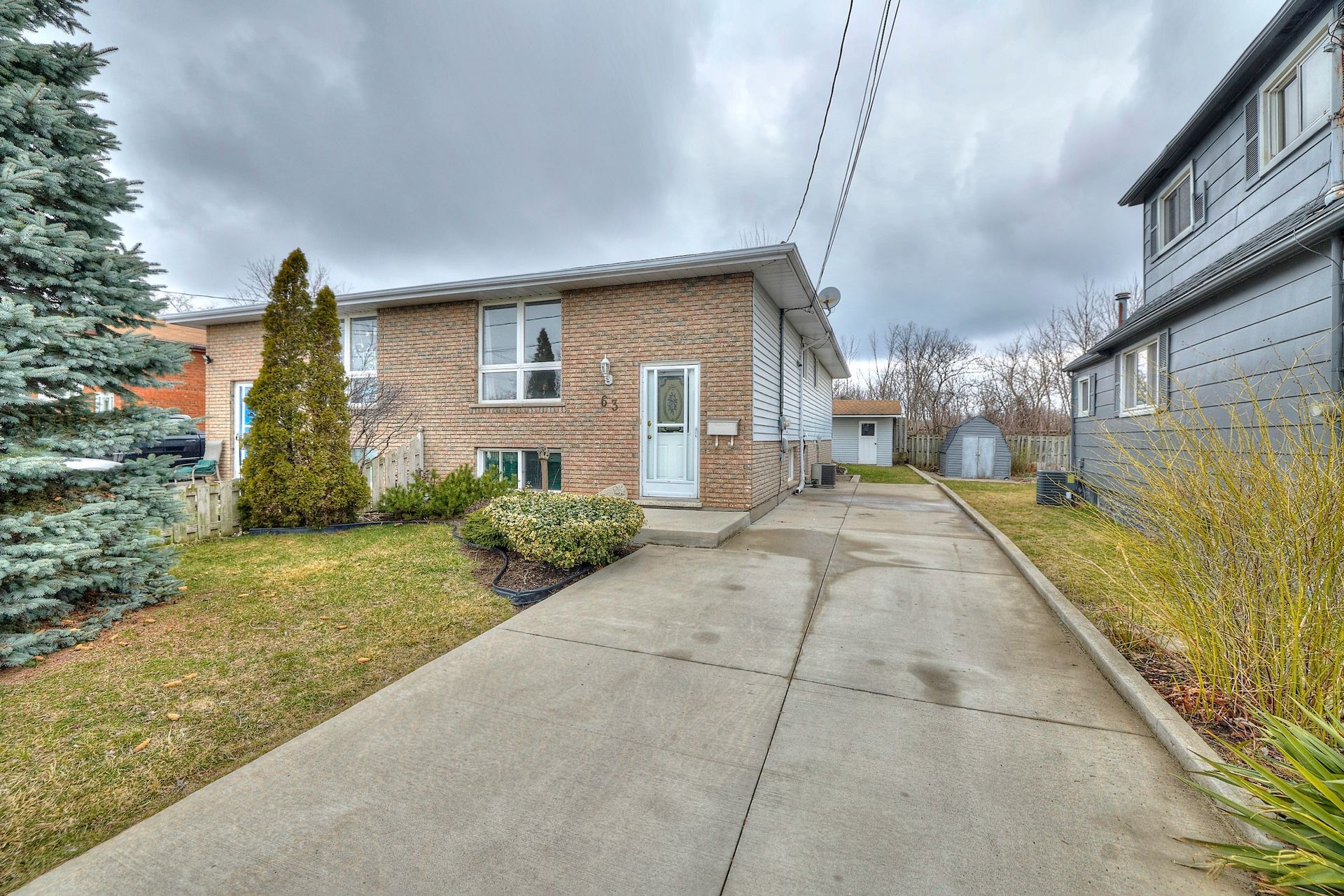 A captivating view of a quaint and charming semi-detached residential home.