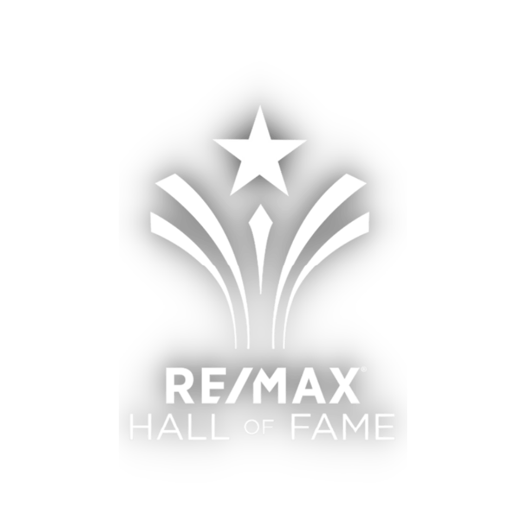 The prestigious RE/MAX Hall of Fame logo awarded to Kim Robinson, showcasing a vibrant firework and star, symbolizing true mastery in the real estate industry. This highly coveted career award is achieved through an agent's exceptional individual gross commission income (GCI) accumulated over time at RE/MAX.