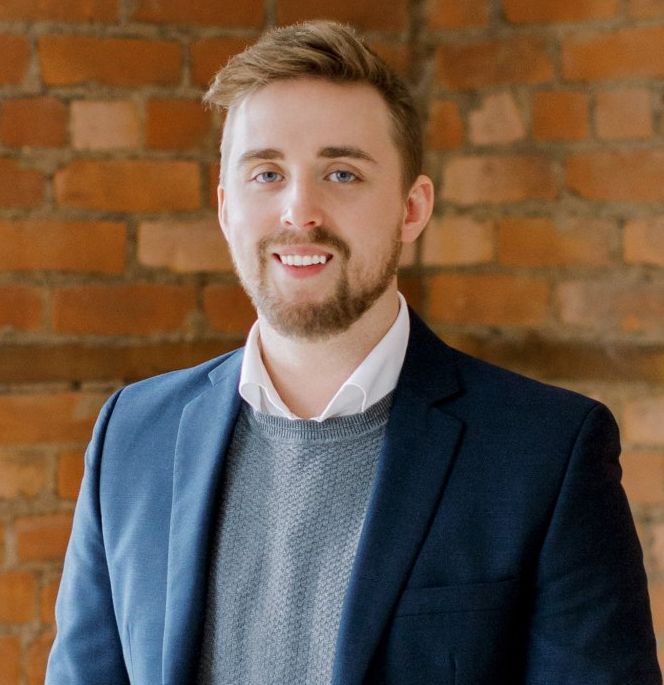 Portrait picture of Anthony Foster, the dedicated assistant to Kim Robinson, overseeing marketing and operations.