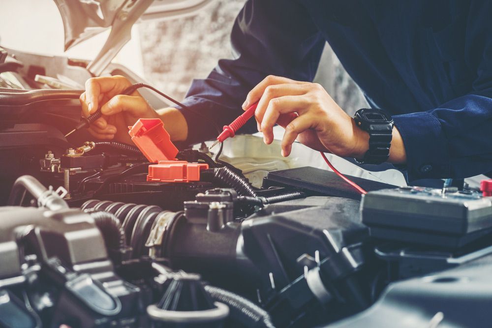 Hands Of Car Mechanic Working In Auto Repair Service — East Coast Mechanic in Nambucca Heads, NSW
