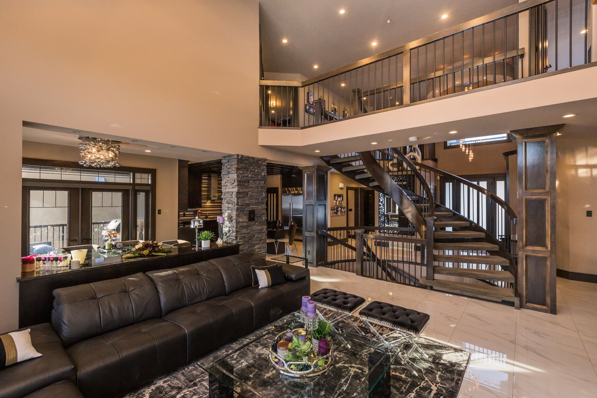 There is a spiral staircase in the middle of the living room.