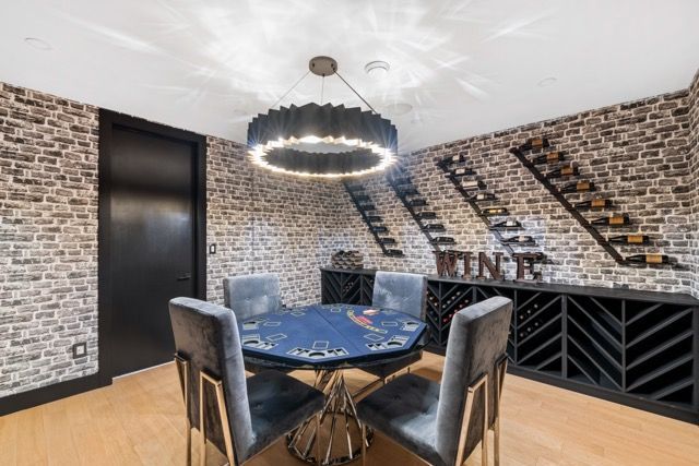 There is a poker table in the middle of the room.